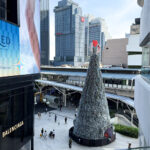 The large Christmas tree in front of Emquartier mall in Phrom Phong station, a festive time in Bangkok.
