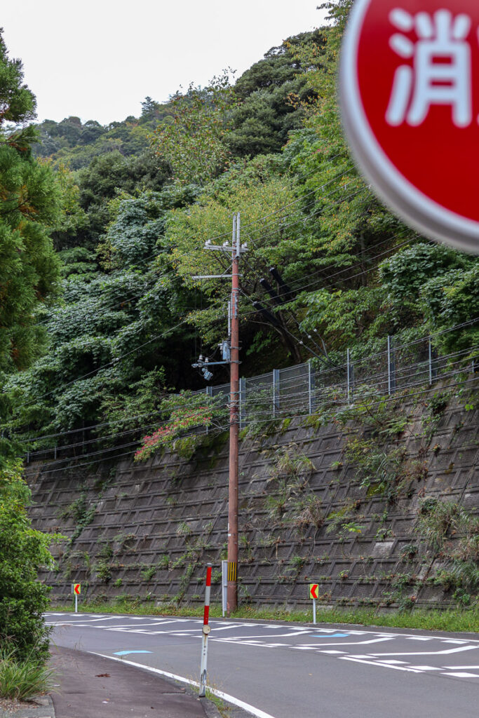A mountainous road view at Shitsumi, Obama, behind a stop sign