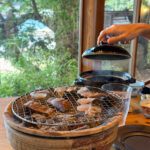 Charcoal grill heshiko and other fish along with rice in traditional clay pot served at Sea-auberg Shitsumi, Obama.