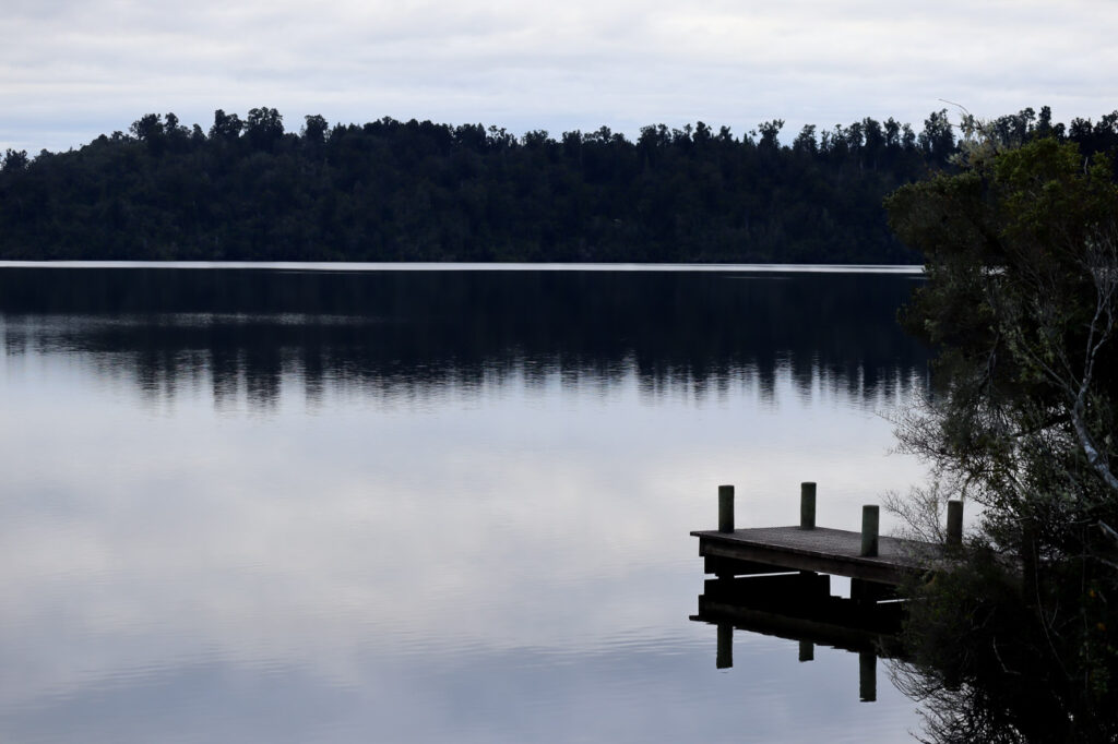 Lake Ianthe Wharf, on a calm weather day, with reflective lake.