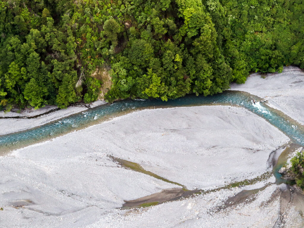 The section of Rakaia River flowing through the Rakaia Gorge visible from the sky during a helicopter tour in Canterbury.