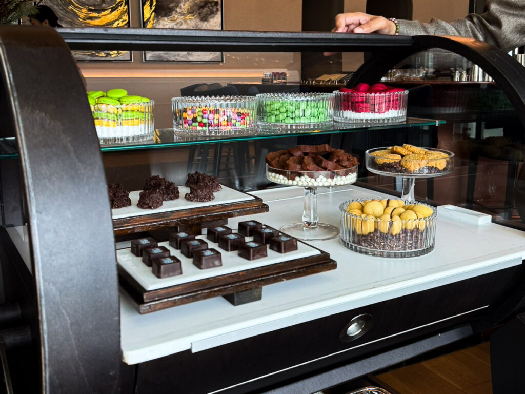 A confectionary trolley serving small sweets, like chocolate, macarons and other items. It mark the end of an afternoon tea course at ritz Carlton BKK.