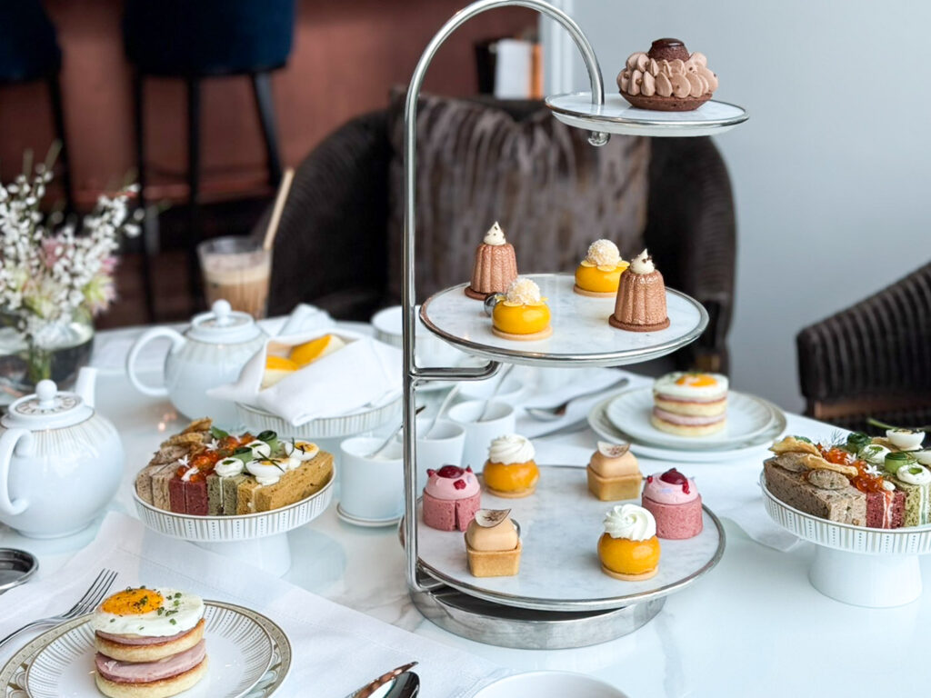 Afternoon Tea dessert tower with 11 small desserts, all carefully crafted, modern flavors at Ritz-Carlton Bangkok.