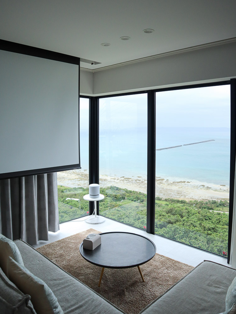 A modern luxury airbnb in Uruma, Okinawa. Big window in the living room looking out to the sea, and a gentle natural light lit up the interior.