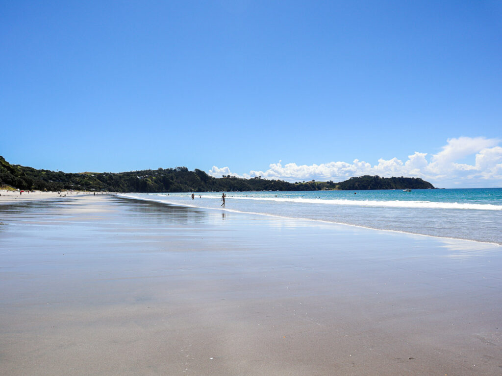 Onetangi Beach on Waiheke Island. The spacious paradise of summer, blue sky and gorgeous sand.