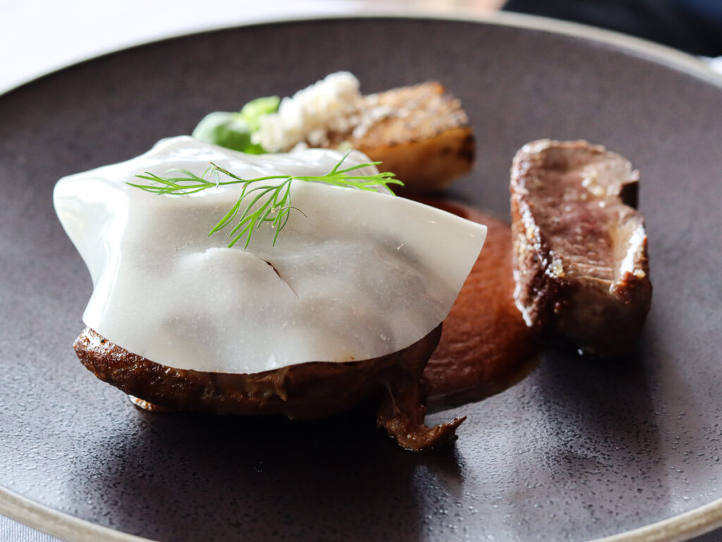 A fine dining mait meat dish. An art on the plate at Mudbrick restaurant.