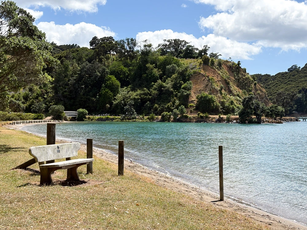 The Man O' War bay in full sun shine, a part of the beach more remote on Waiheke.