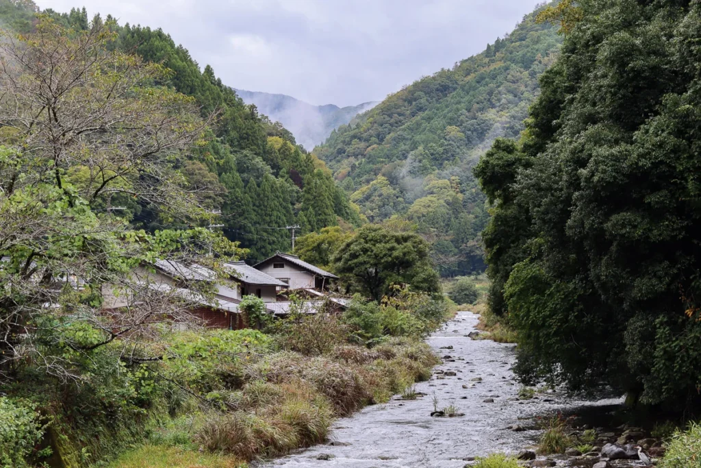 The view as we drive past a bridge in Toyooka, beautiful river and mountains; a hidden gem in rural Japan.