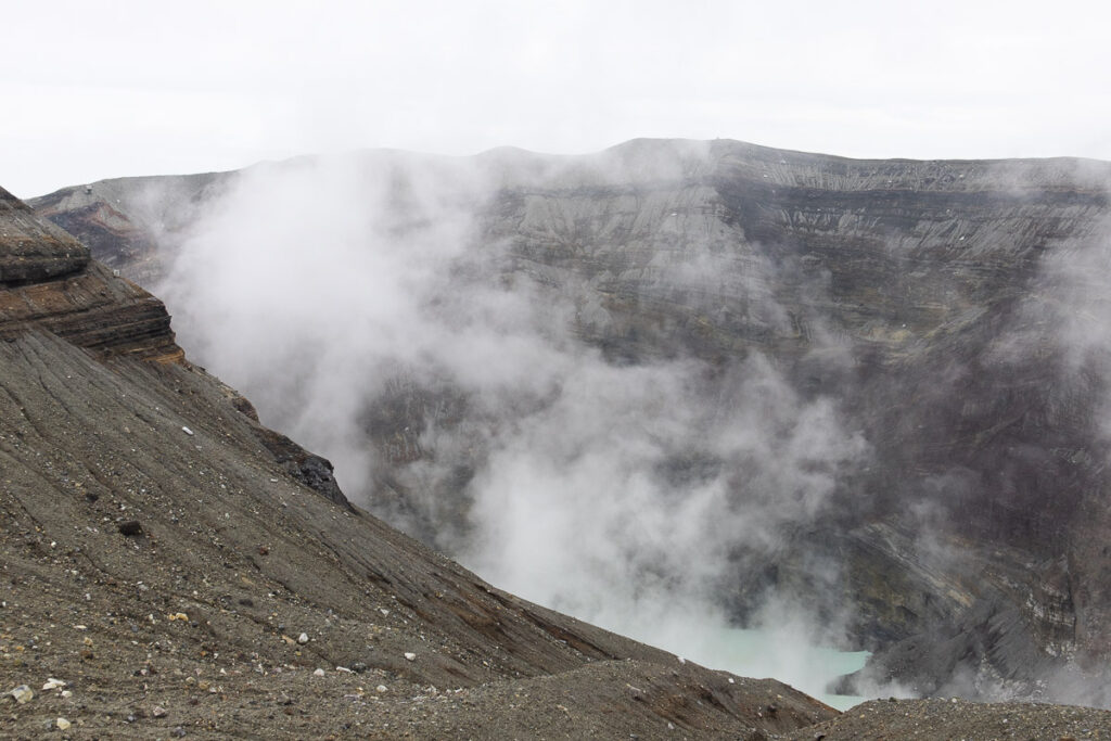 Mount Aso Crater, the steam and gas that is pouring out continueously from the opening, a dramatic side of nature.