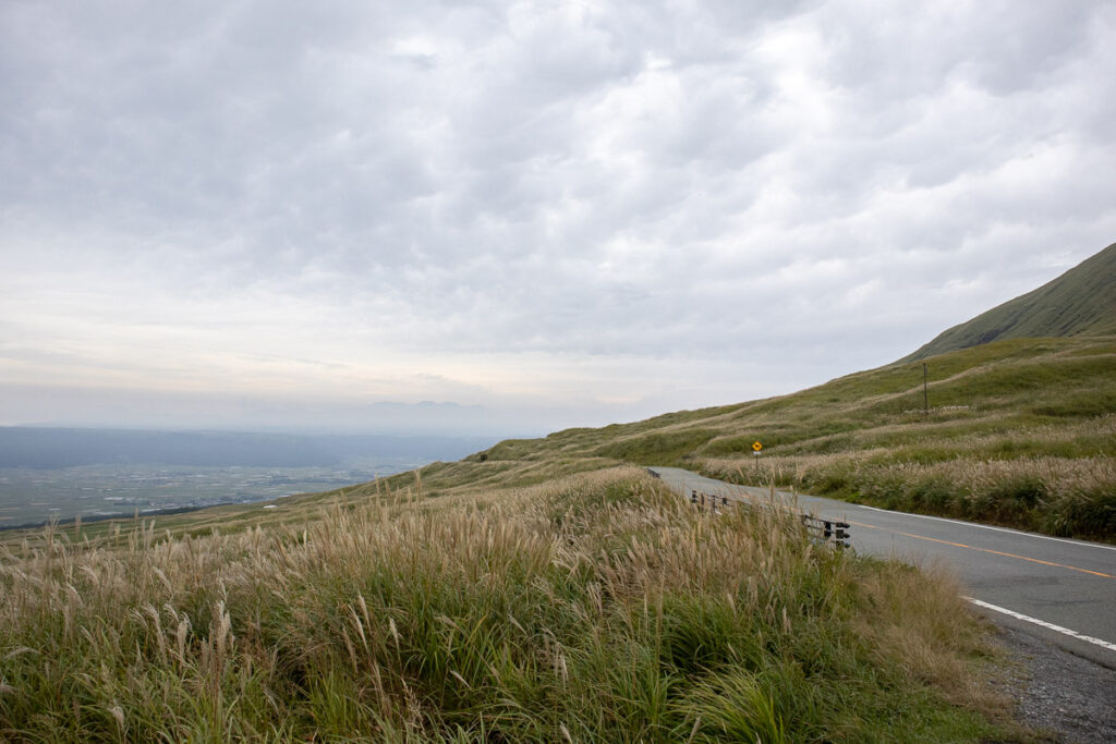 A road on Mount Aso near Kami-Komezuka. A tranquil mountain spot you can feel the gentle wind and quietness.