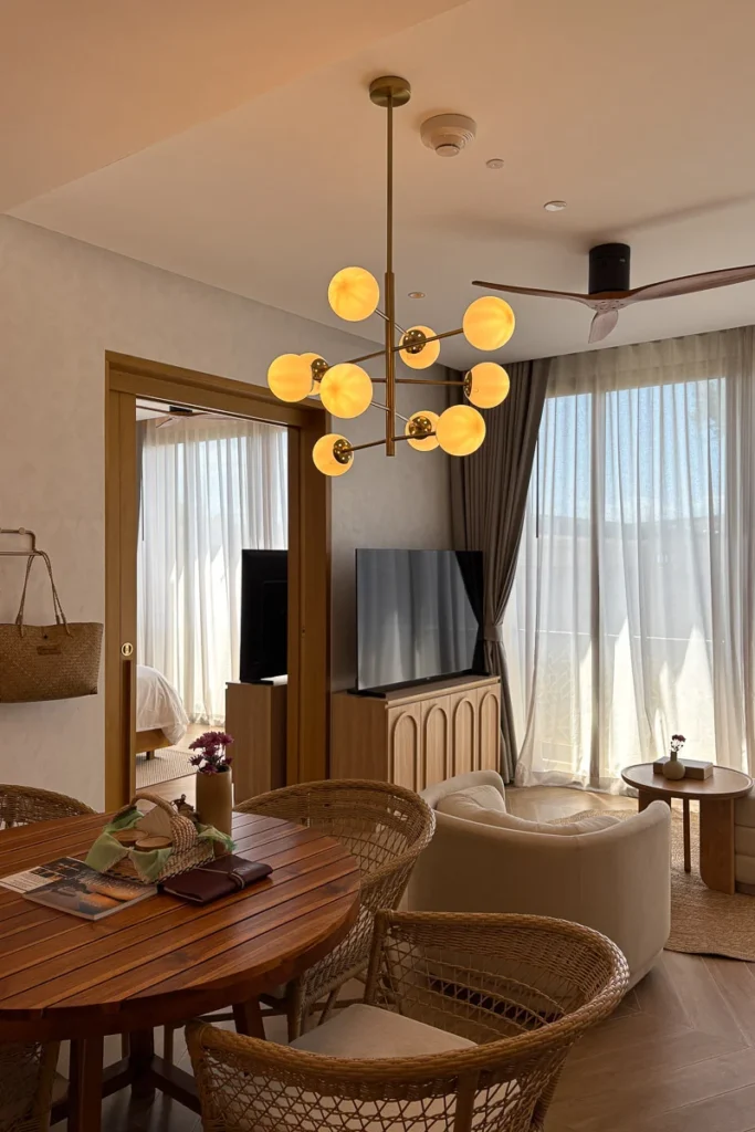 Marasca Samui Two-bedroom Suite interior, natural light mix with yellow interior lighting create a calming mood, with a touch of luxury.