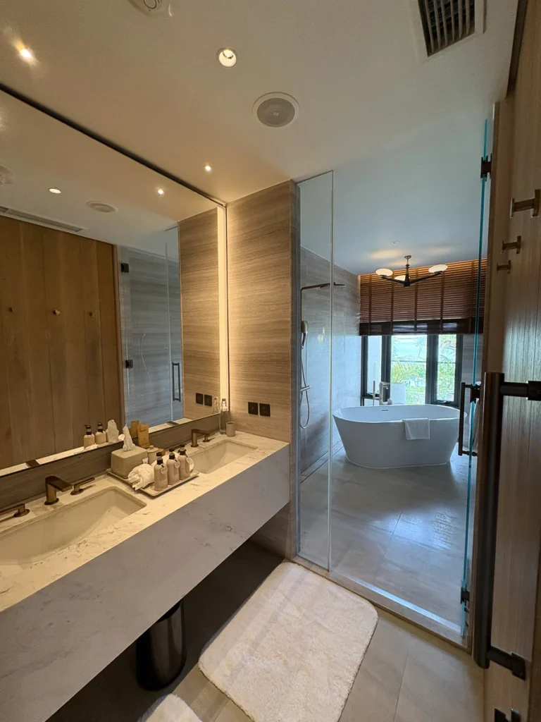 A stylish bathroom design at Centara Reserve Samui, enjoying a bathtub with a view out to the sea.
