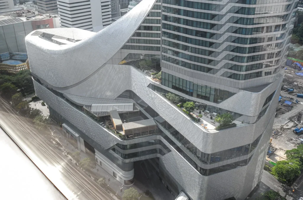 The spectacular fluid design of Central Embassy shopping mall building from a corner room of Okura Prestige Bangkok.
