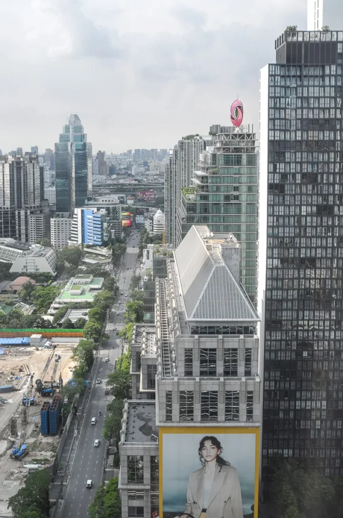 A view of the highrises from a standard room at Okura Prestige Bangkok .