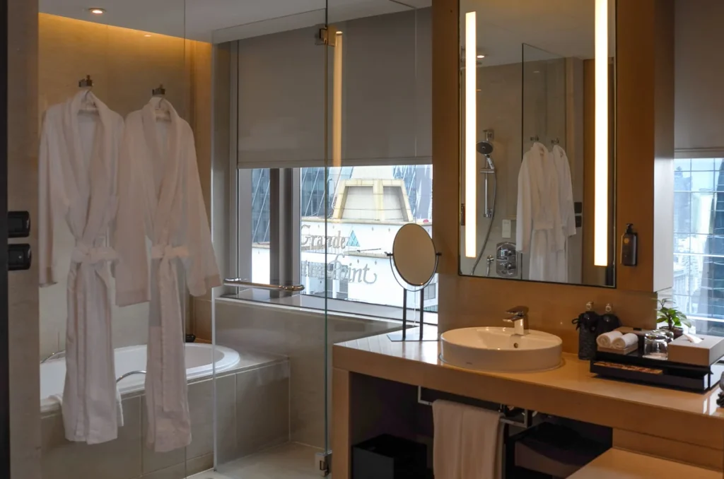 Shower and sink area at Okura Prestige Bangkok, enjoy the view as you soak in the bath.