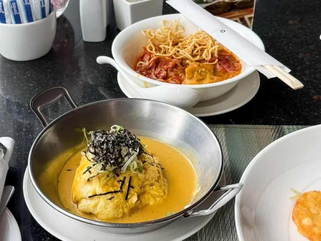 Made-to-order hot dishes at morning breakfast of Okura Prestige Bangkok.