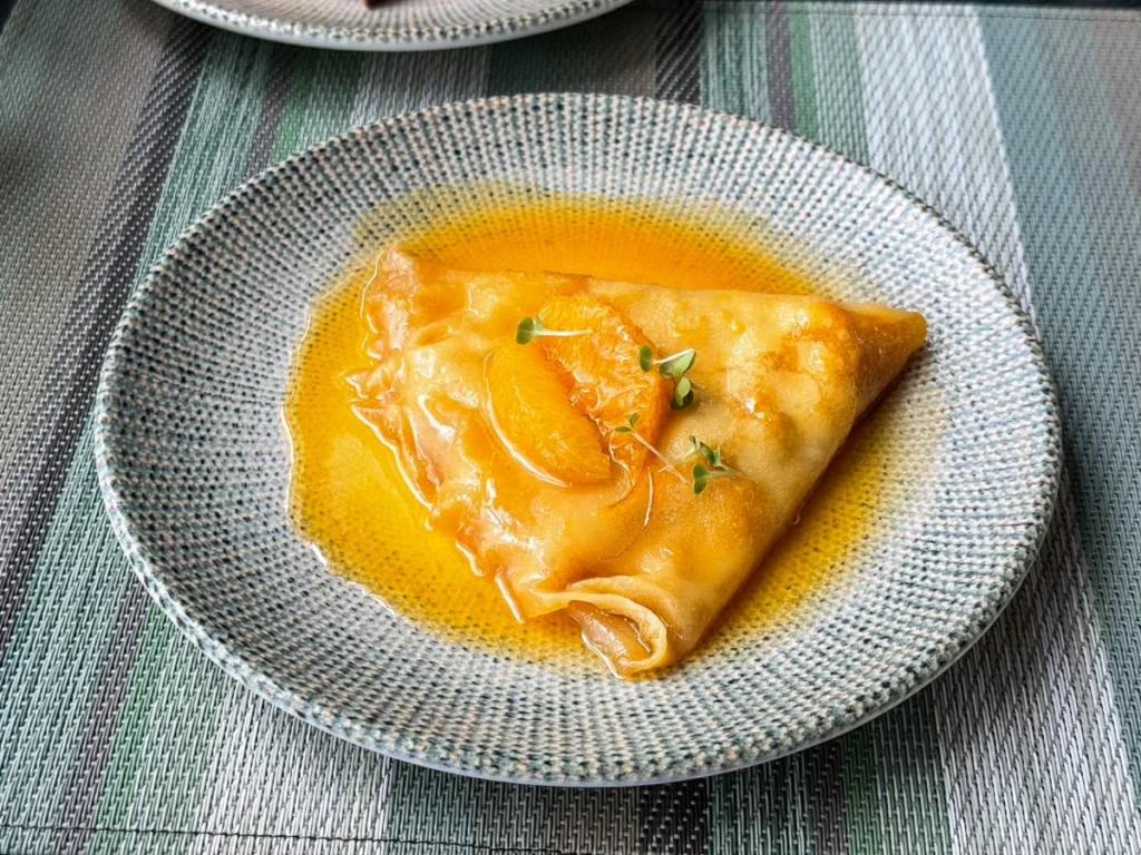 A perfect looking orange crape at Okura Prestige hotel breakfast service, this is how a great morning begins.