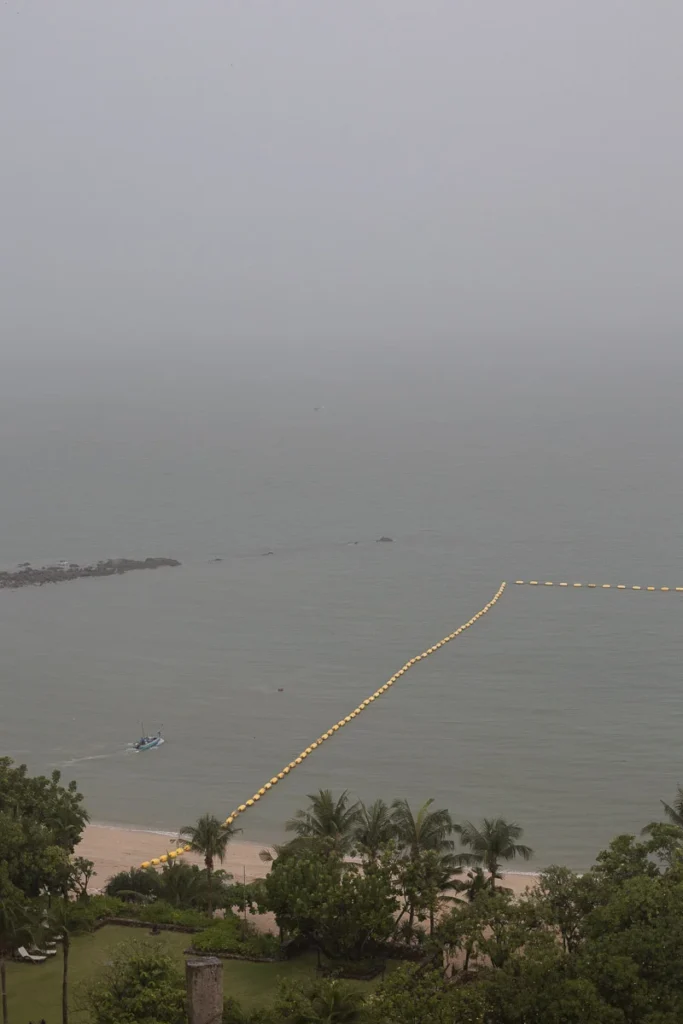 The sea during a heavy rain in Pattaya, what used to be a view of an island is now covered by mist.