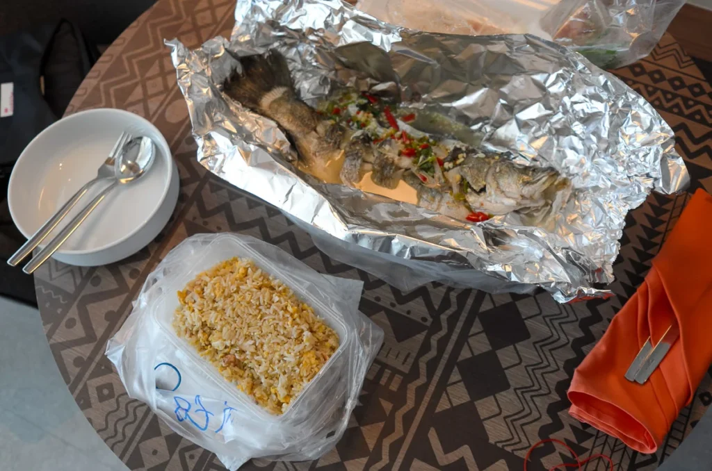 The kind of food you can order via a delivery application in Pattaya, fried rice and a whole fish.