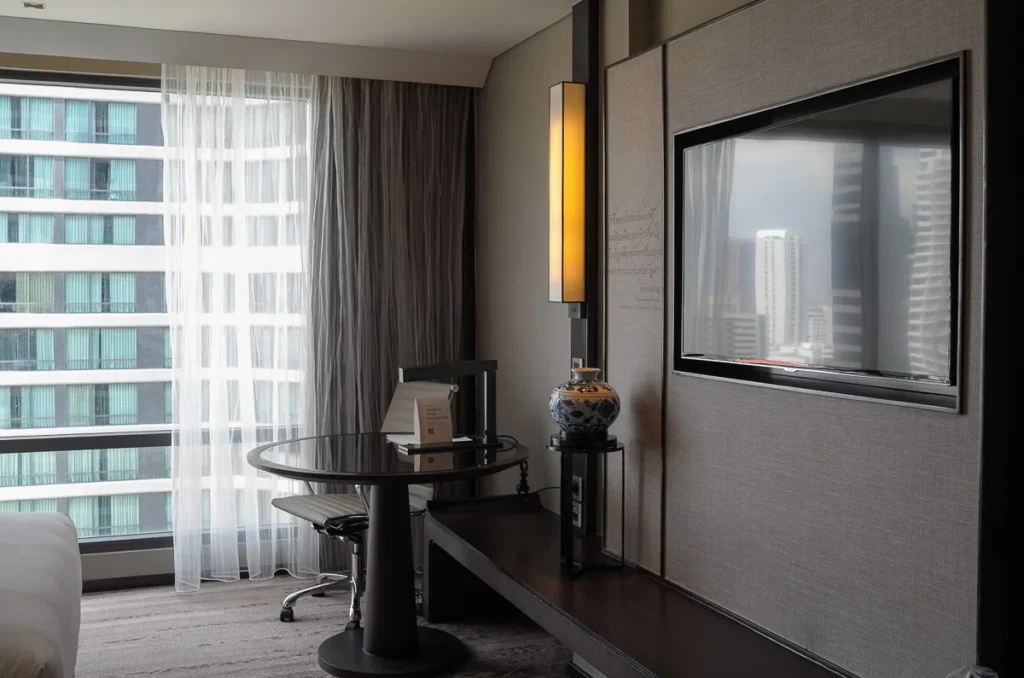 A working table and smart TV for working and relaxing at Marriott Marquis Queen's Park.