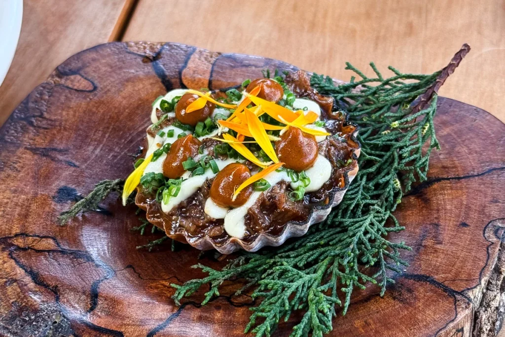 Wild Goat Tart served at one Michelin star Ahi., a strong dish with strong flavor.