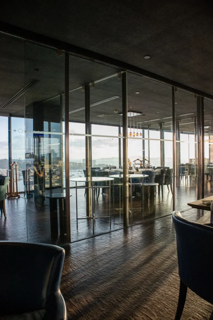 Horizon Rooftop Restaurant and Bar as the evening sunset shines inside casting shadows and giving the place a warm hue.