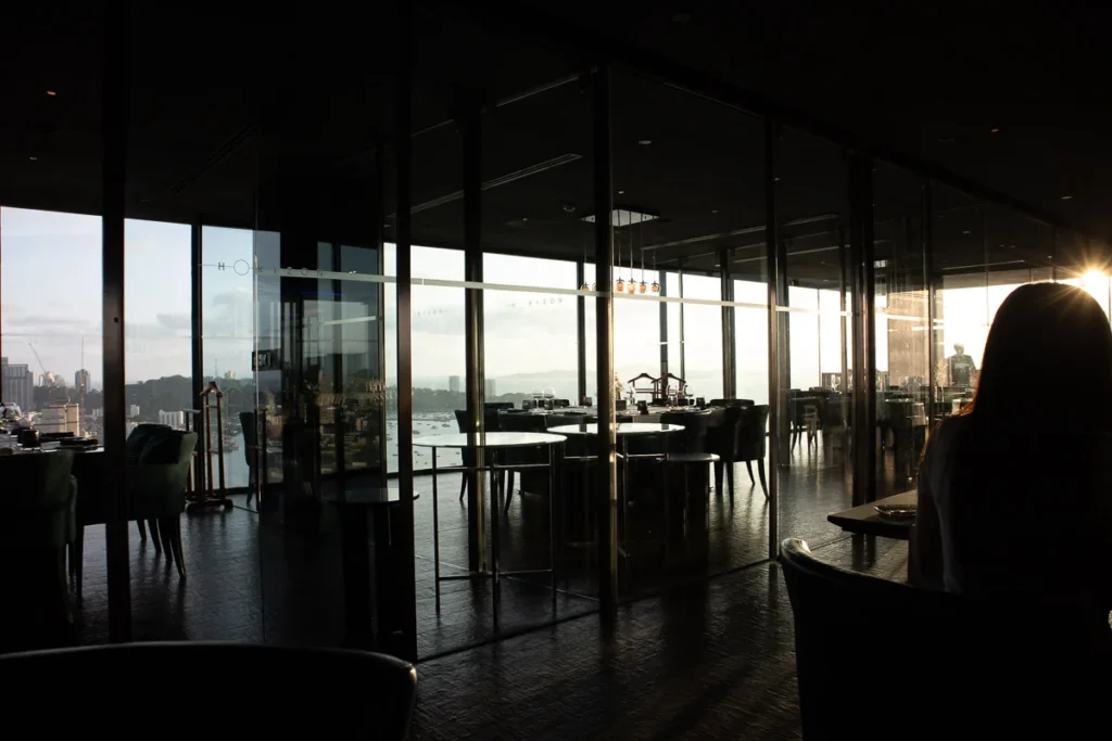 Horizon Rooftop Restaurant and Bar, a panoramic and cinematic view of the restaurant during sunset in Pattaya.