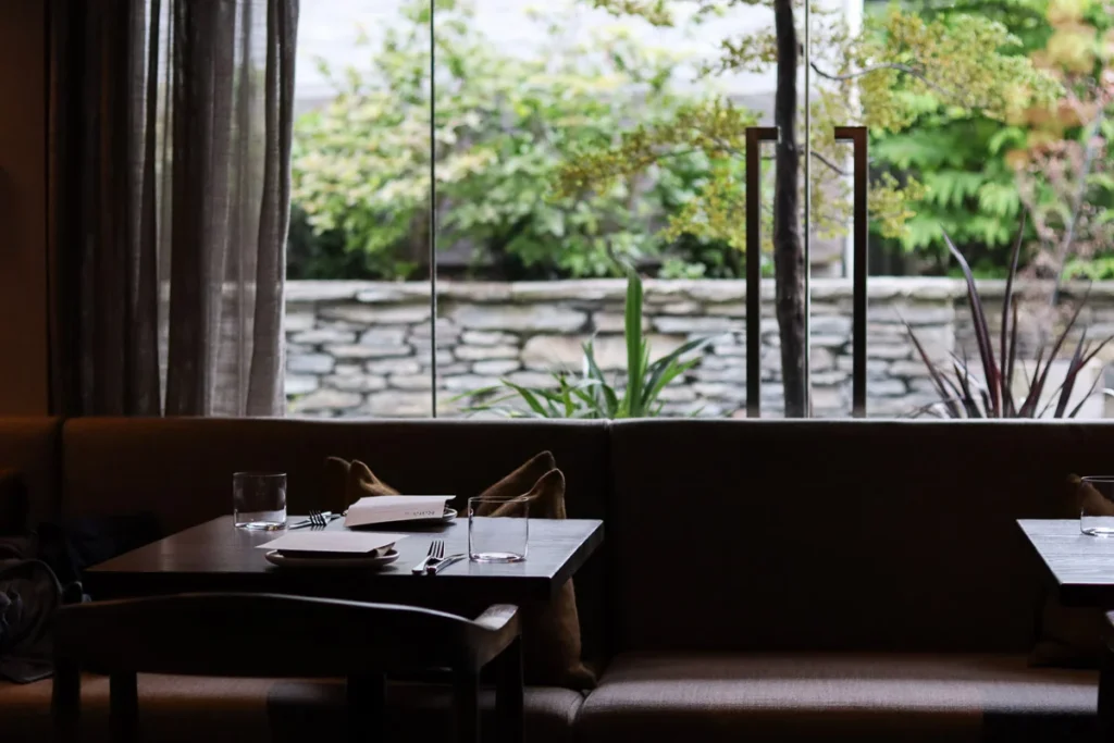 A relaxing upscale restaurant setting to dine in, the window seat at Rātā in Queenstown.