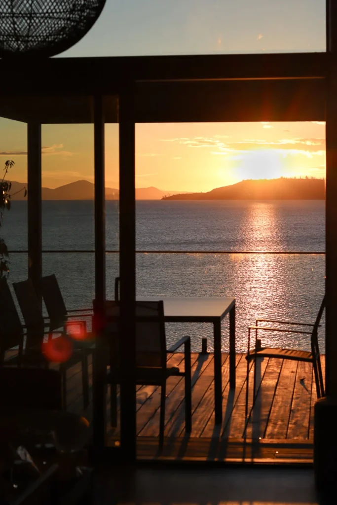 A romantic view to be hold during the sunset at Lake Taupō from an Airbnb, Roam Taupo Upper Terrace.
