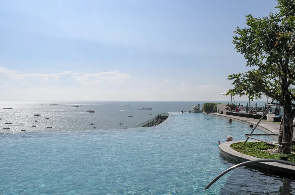 Infinity pool that looks like it is connected to the sea water below at Hilton Pattaya Hotel.