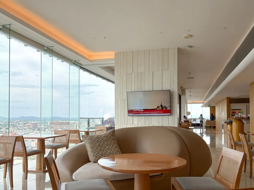 Hilton Pattaya club lounge area, a high floor seating space with food and drink bar.