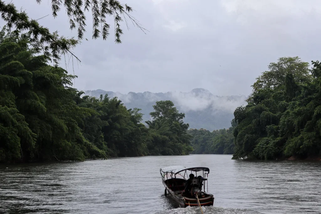 River Khwae Noi raft experience during rainy season when fog hovers along the mountain