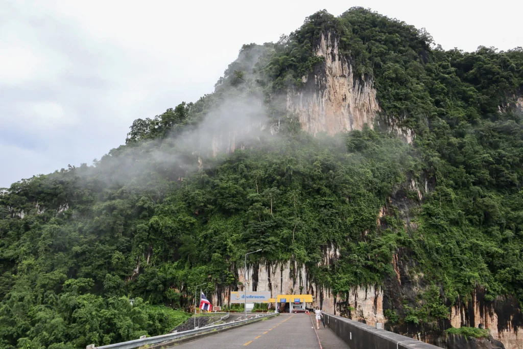 A view of the mountain at one side of Vajiralongkorn Dam with cloud covering the peak.