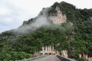 A view of the mountain at one side of Vajiralongkorn Dam with cloud covering the peak.