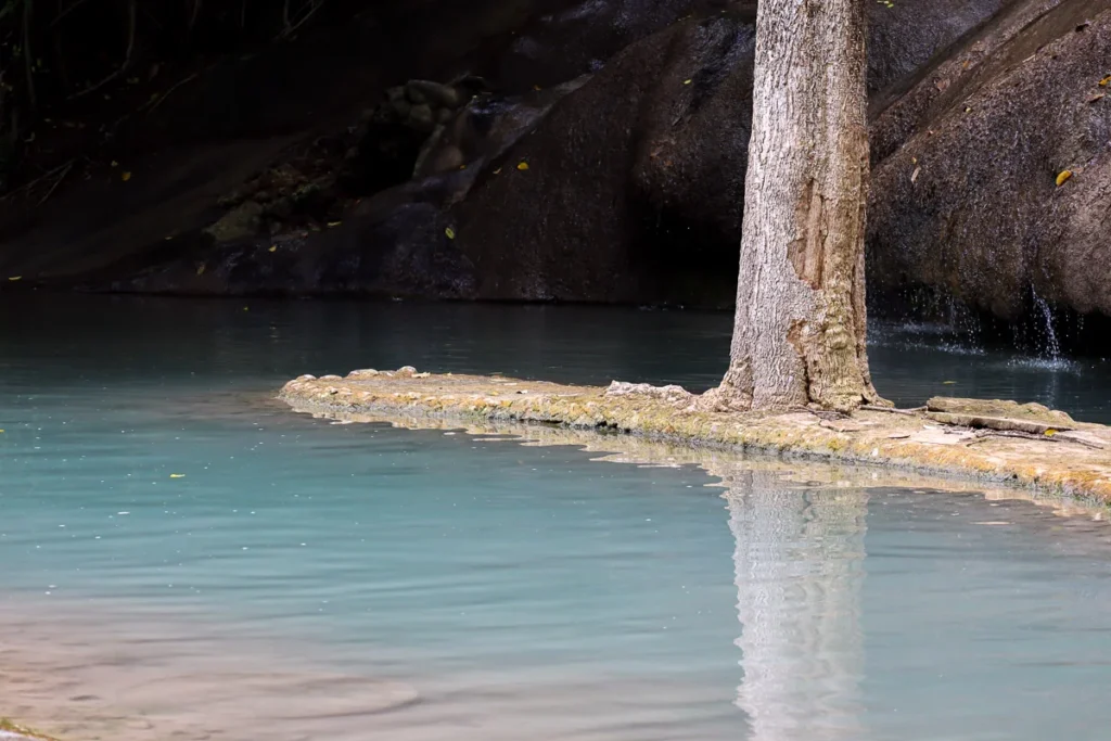 The light blue water of Sai Yok Noi Waterfall