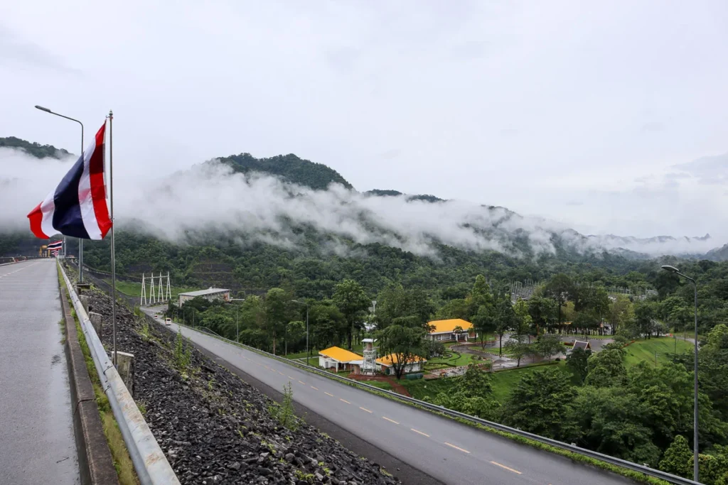 Fog on the mountains at Vajiralongkorn Dam during a light rain